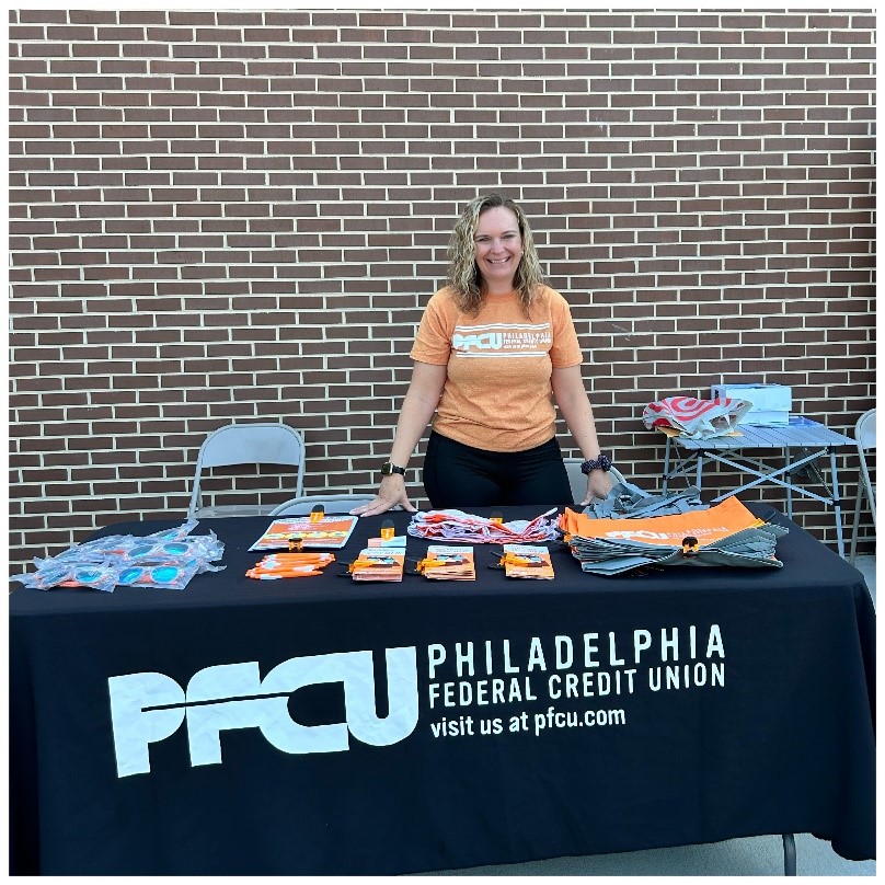 Woman at Back-to-School Fair PFCU booth