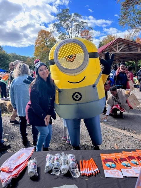PFCU Business Development Specialist, Yorkenia Gomez-Almonte on-site with a minion at the Awbury Arboretum Harvest Fest.