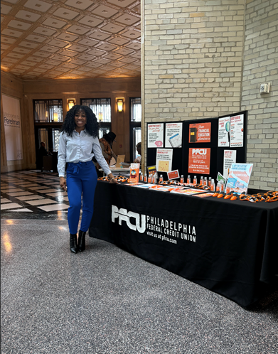 Financial Educator Yahné Jackson distributed literature to the attendees of the forum.