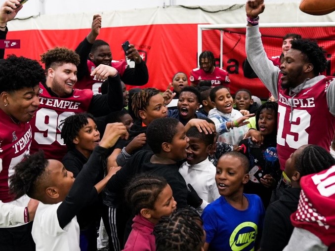 Group of young men and members of football team.