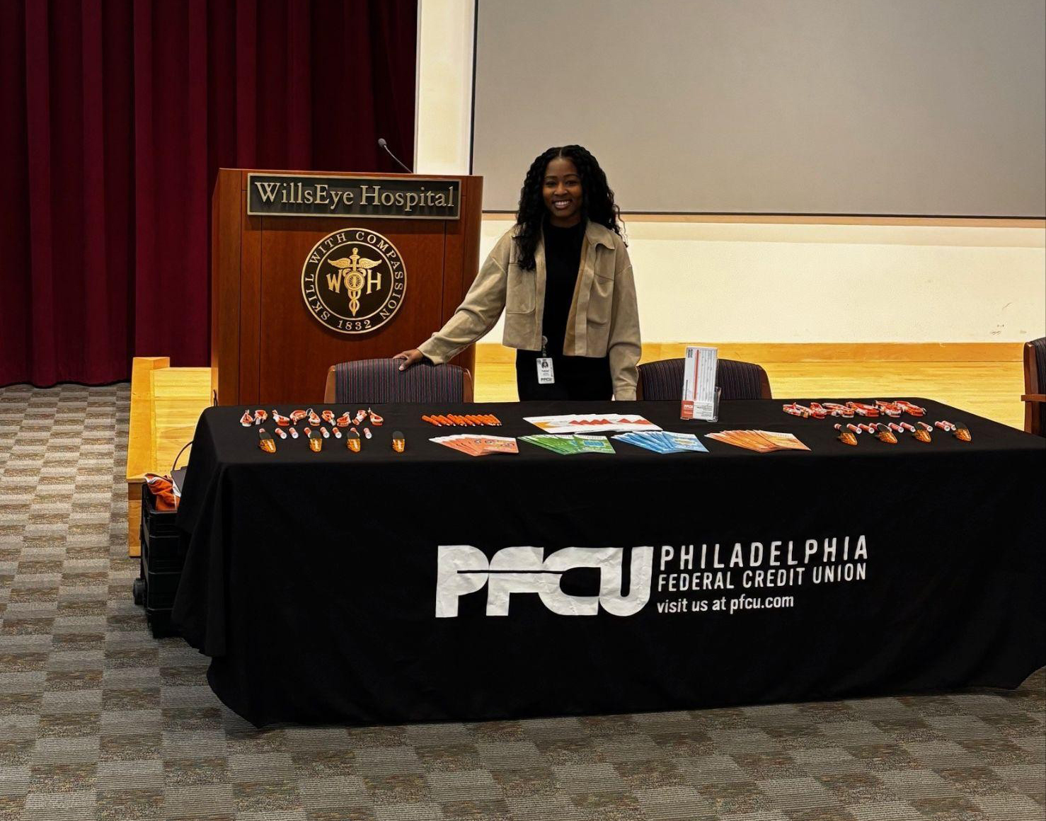 Yahné Jackson, PFCU Accredited Financial Educator and Community Relations Specialist, representing PFCU during the Wills Eye Hospital Benefits Fair.