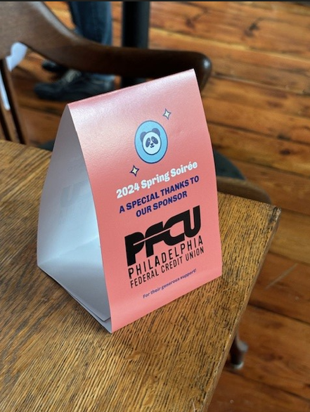 PFCU 2024 Spring Soiree sign on table.